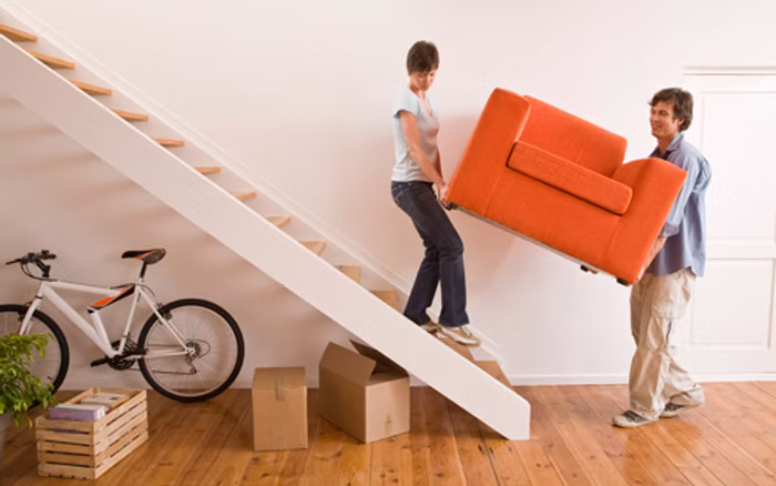People moving an item for same-day delivery